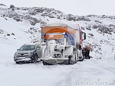 Car rescued by a snowplow Stock Photo