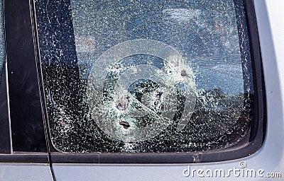 Car riddled with bullets. War of Russia against Ukraine. A car of civilians shot by the Russian military during the evacuation of Stock Photo