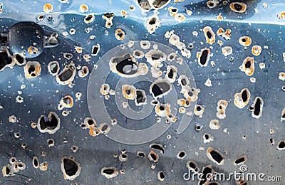 Car riddled with bullets. War of Russia against Ukraine. A car of civilians shot by the Russian military during the evacuation of Stock Photo