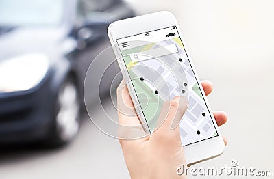 Car or ride share mobile app in smartphone. Carsharing, ridesharing or carpool service. Sharing economy concept. Person ordering. Stock Photo