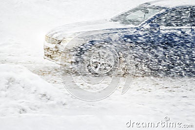 Car rides through a snowstorm Stock Photo