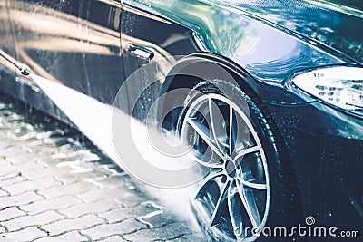 Car Rims Pressure Washing Stock Photo