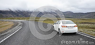 Car on a road in a countryside Stock Photo