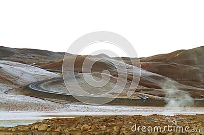 Car running on the rural curvy windy road after light snow, Northern Iceland Stock Photo