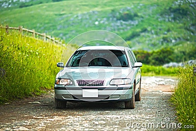 A car that runs exhilaratingly in the meadow Stock Photo
