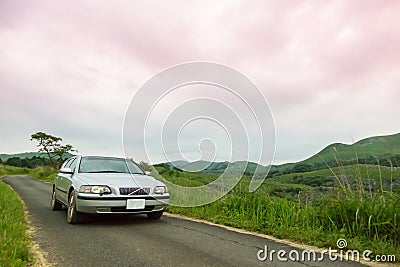 A car that runs exhilaratingly in the meadow Stock Photo