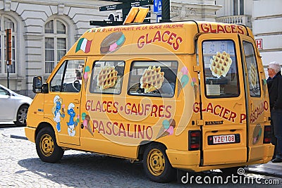 Street food from the orange car selling waffles with fruits and cream in Brussels, Belgium Editorial Stock Photo