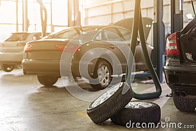 Car service center. Vehicle raised on lift at maintenance station. Auomobile repair and check up Stock Photo