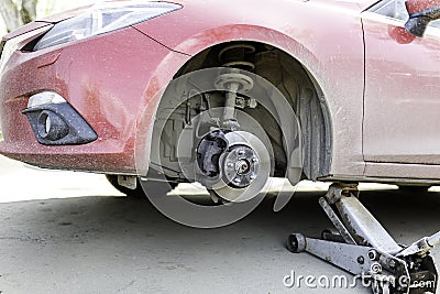 Car service, nut of fixture of a wheel of the car on a white background, Stock Photo