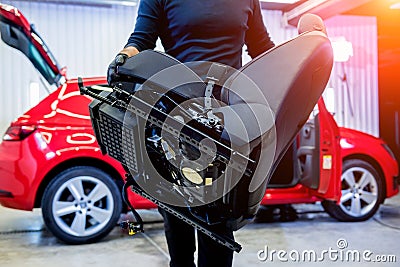 Car service worker disassemble the interior of the car Stock Photo