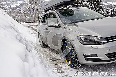 Car with snow chains on iced street Stock Photo