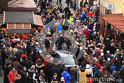 Car stucked in crowd of people on carnival Editorial Stock Photo