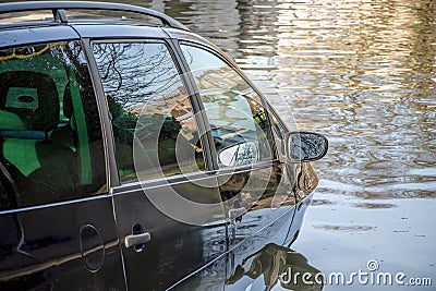 Car submerged in flood water. Stock Photo
