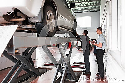 Car suspension system inspection at workshop Stock Photo