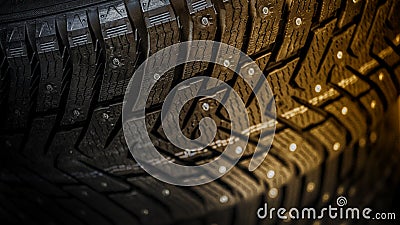 Car tire with studs, macro, blurred background Stock Photo