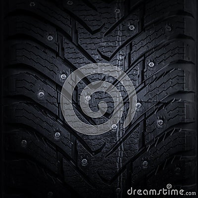 Car tire with studs macro, fragment, blurred backgroundd Stock Photo