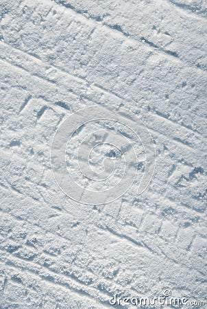 Car tire tracks in snow Stock Photo