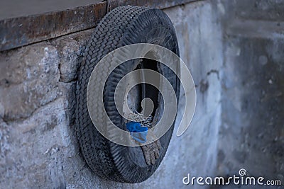 Car tire used as a shelf for things Stock Photo