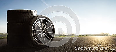 Car tires on a contry road Stock Photo