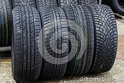 Car tires with different treads for summer, all season, winter and winter with studs Stock Photo