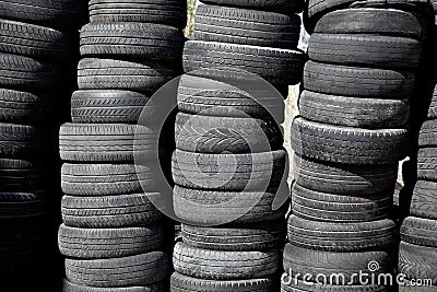 Car tires pneus stacked in rows Stock Photo