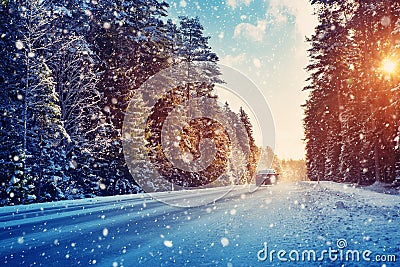 Car tires on winter road Stock Photo