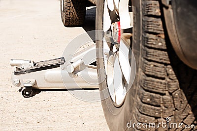 Car tires with winter spikes and dirt. replacement of wheels before the new season, Stock Photo