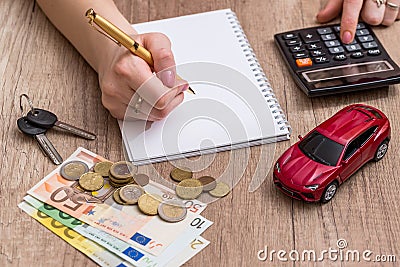 Car toy and key with calculator and euro money Stock Photo