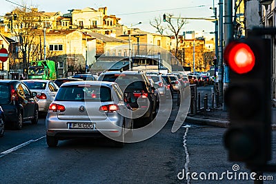 Car traffic at rush hour stopped at red light. Car pollution, traffic jam in the morning and evening in the capital city of Editorial Stock Photo