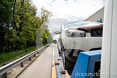 car is transported on tow truck.transporting cars after accidents and breakdowns Stock Photo