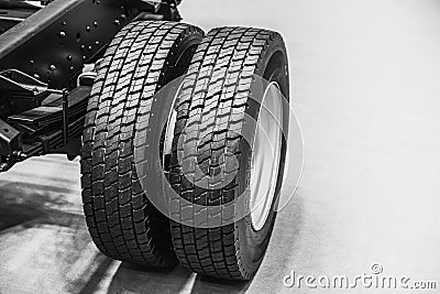 Car Truck Tire dual wheel Leaf Springs with Chassis Body Stock Photo