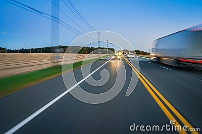 Car and truck traffic on rural highway Stock Photo