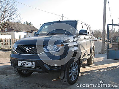 car UAZ Patriot gray color outdoor the sun Editorial Stock Photo