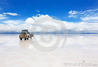 Car on the Uyuni Salar in Bolivia Stock Photo