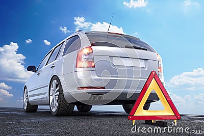 Car and warning triangle on the side roadside Stock Photo