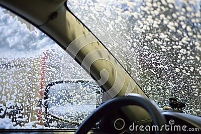 Car wash, soap foam on glass Stock Photo