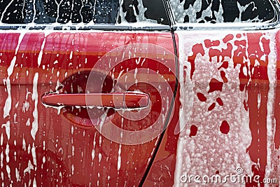 Manual car wash. Cleaning Car Using High Pressure Water. Washing with soap. Close up concept. Stock Photo