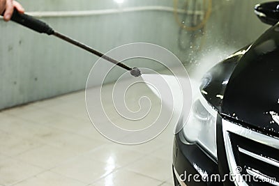 Car washing by jet of water close-up. Stock Photo