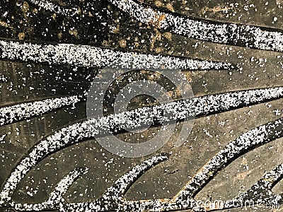 Car wheel protector covered with little snowflakes. Stock Photo