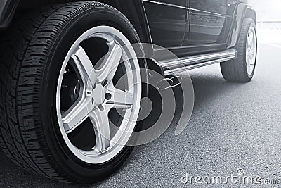 Car wheels close up on a background of asphalt. Car tires. Car wheel close-up Stock Photo