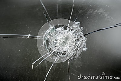 Car window glass pane hit and cracked Stock Photo