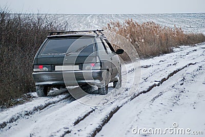 The car on a winter dirt road Stock Photo