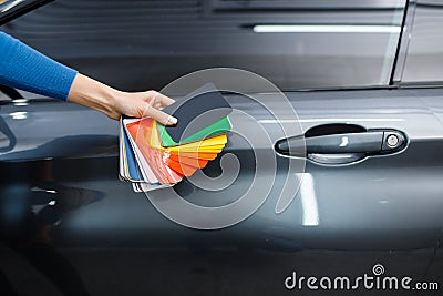 Car wrapping, hand with foil or film color palette Stock Photo