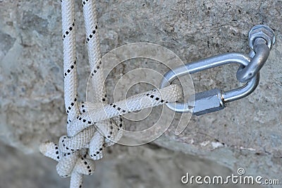 Carabine and hook with rope in stone Stock Photo