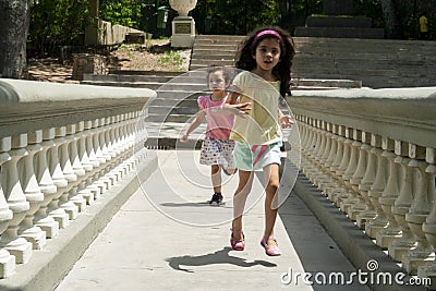 Caracas,Venezuela.Two little girls running in El Calvario Park, Ezequiel Zamora Park Editorial Stock Photo