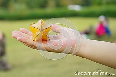 Carambola on hand. Stock Photo