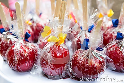 Caramelized apples sold at fairs in Brazil. Known with Apple of Love Stock Photo