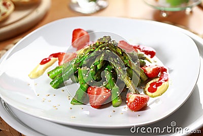 Caramelized asparagus with strawberry Stock Photo