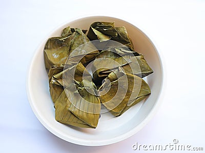 Carang gesing is Javanese traditional food made from Banana steamed in banana leaf with coconut milk, add pandanus leaf for its Stock Photo