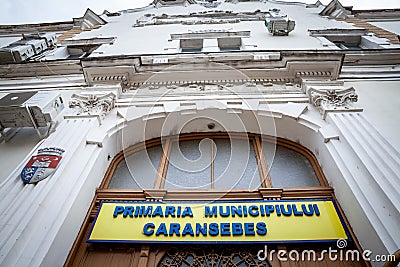 Entrance to the city hall of Caransebes, also called in Romanian Primaria Municipului Caransebes. Editorial Stock Photo